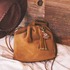 映画『トイ・ストーリー5』のGLOBAL WORK限定コレクション　「チャーム付き巾着 BAG」使用イメージ